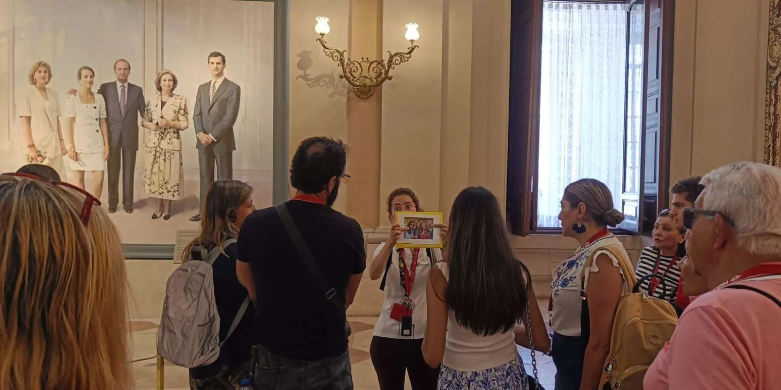 Group looking at paintings during a museum visit
