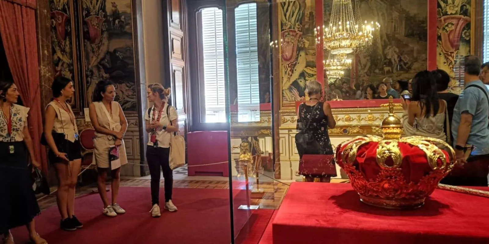 Guide in a decorated royal interior