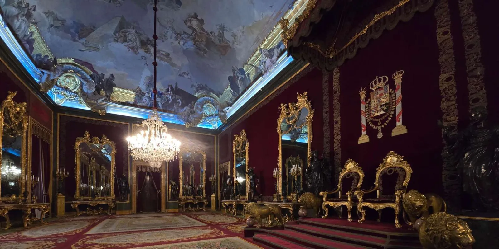Red-walled throne room and ceiling fresco