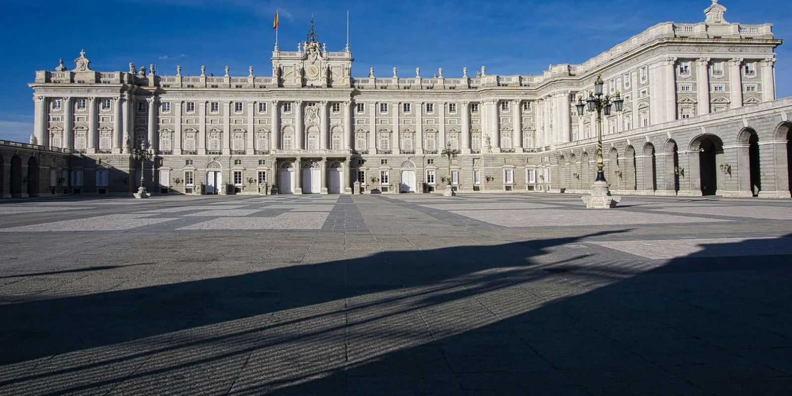 Palace façade with long courtyard shadows