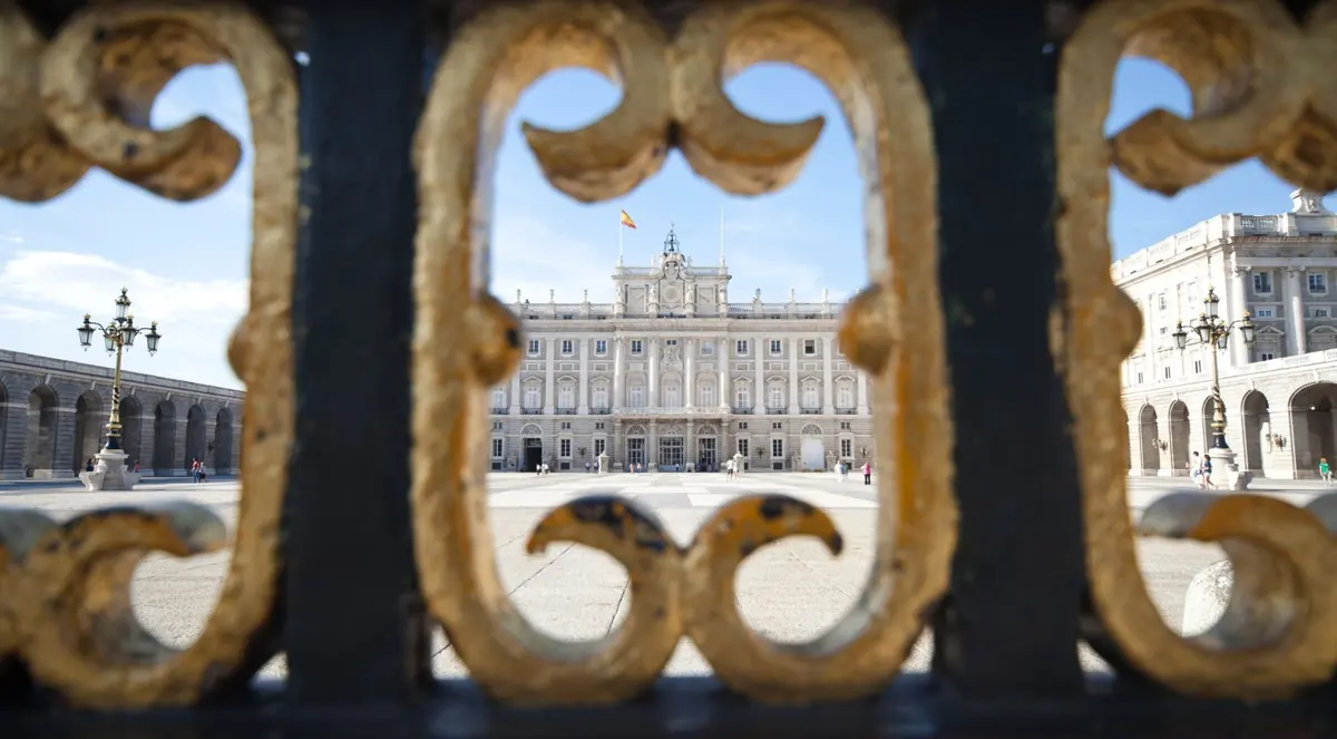 Royal Palace seen through gilded gate details